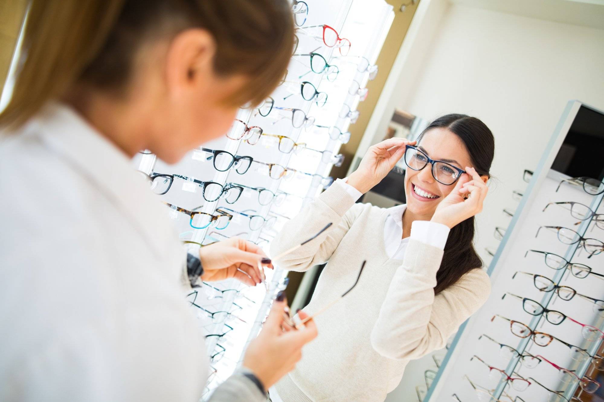 Woman trying on eyeglasses in optical shop Discover the Best New Year Prep in Lewisville at Castle Hills Marketplace